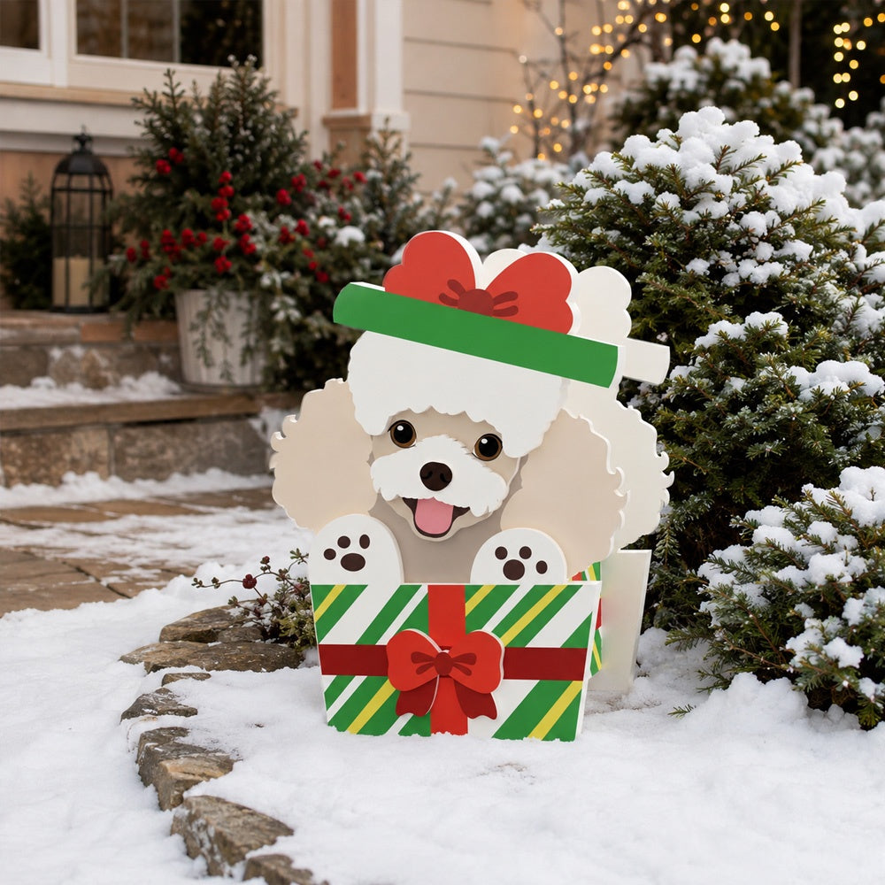 Christmas Poodle dog planter filled with fresh flowers is placed in the garden