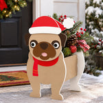 Christmas Pug dog planter filled with fresh flowers is placed in the garden