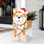 Christmas Shiba Inu dog planter filled with fresh flowers is placed in the garden