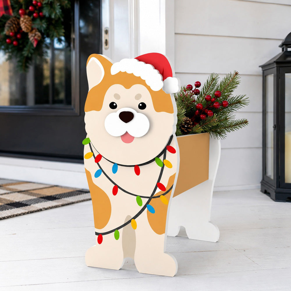 Christmas Shiba Inu dog planter filled with fresh flowers is placed in the garden