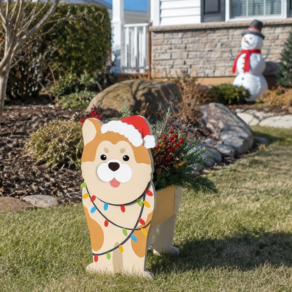 Christmas Shiba Inu dog planter filled with fresh flowers is placed in the garden