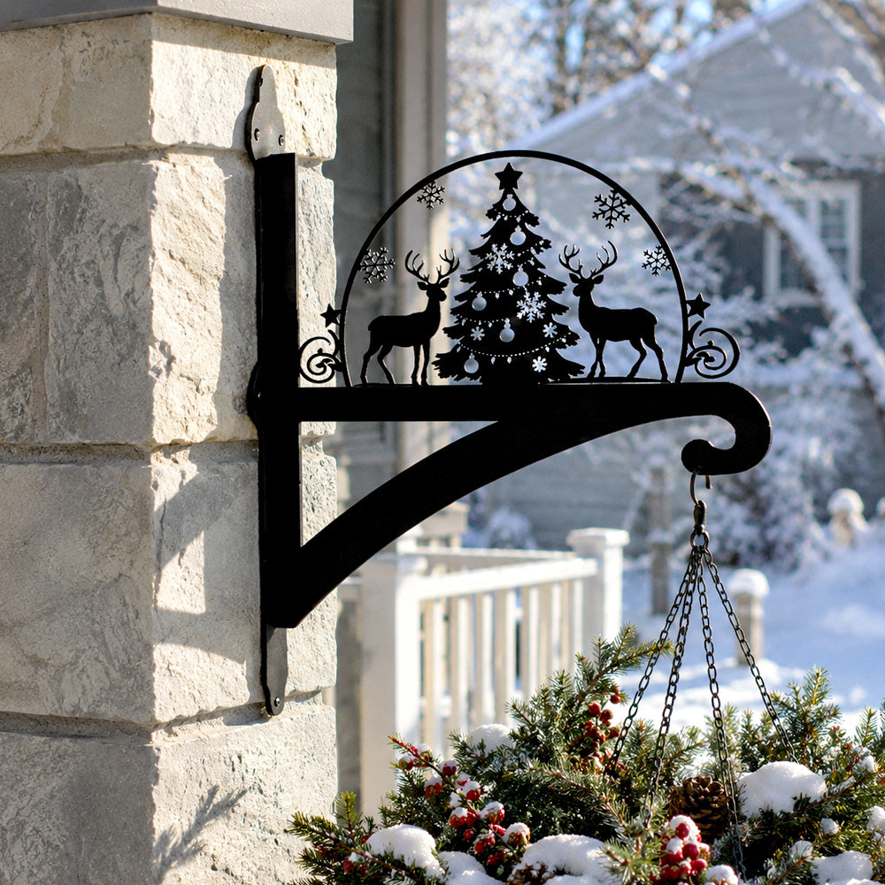 Christmas tree and reindeer metal hanging basket bracket mounted on outdoor wall for plant decoration