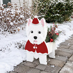 Christmas West Highland White Terrier dog planter filled with fresh flowers is placed in the garden