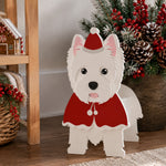 Christmas West Highland White Terrier dog planter filled with fresh flowers is placed in the garden