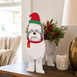 Christmas White Terrier dog planter filled with fresh flowers is placed in the garden