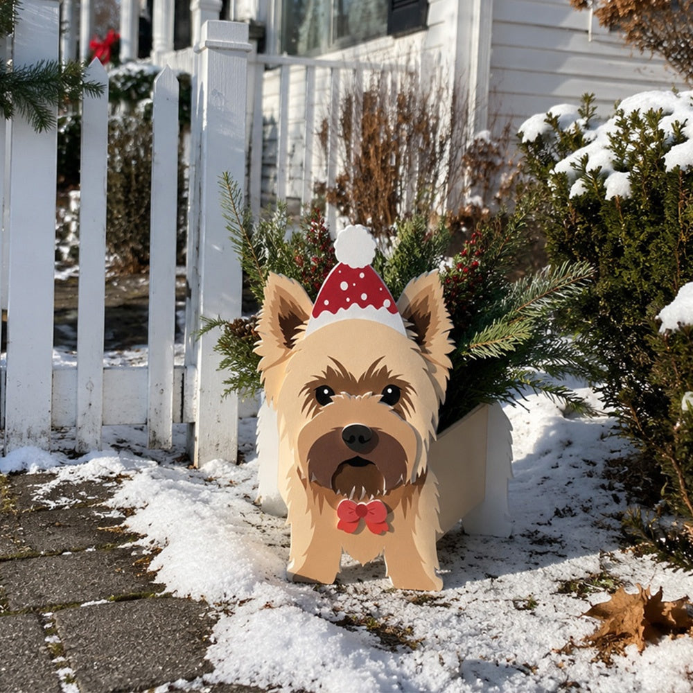 Christmas Yorkshire Terrier dog planter filled with fresh flowers is placed in the garden