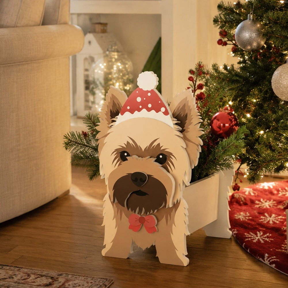 Christmas Yorkshire Terrier dog planter filled with fresh flowers is placed in the garden