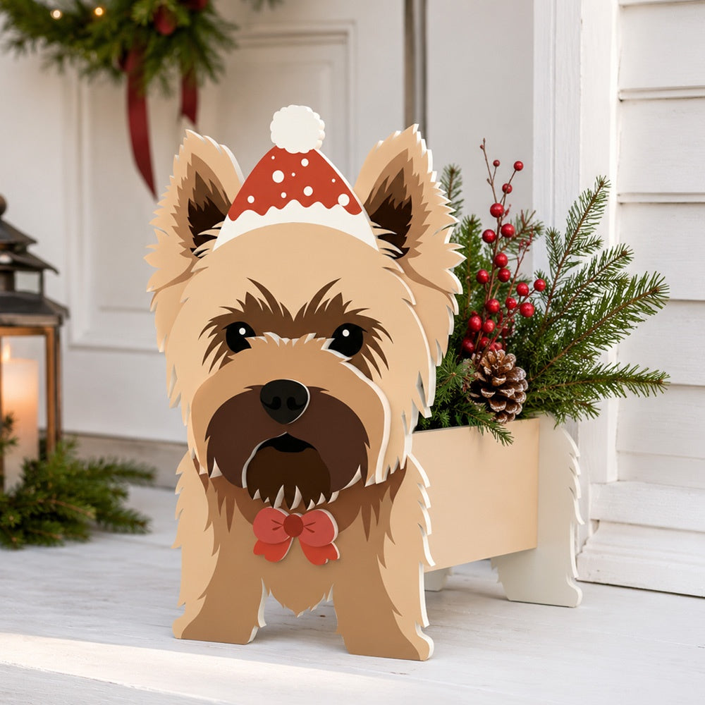 Christmas Yorkshire Terrier dog planter filled with fresh flowers is placed in the garden