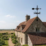 Classic arrow metal weather vane with directional arrows and mounting rod, outdoor roof and garden decoration