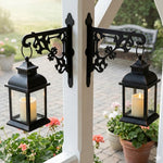 Classic baroque scrollwork metal hanging basket bracket mounted on outdoor wall for plant decoration
