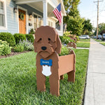 Cockapoo dog planter filled with fresh flowers is placed in the garden