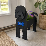 Cockapoo dog planter filled with fresh flowers is placed in the garden