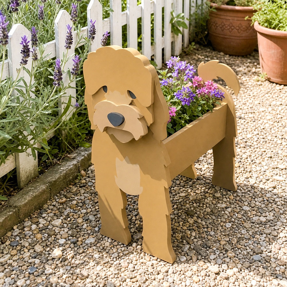 Cockapoo dog planter filled with fresh flowers is placed in the garden