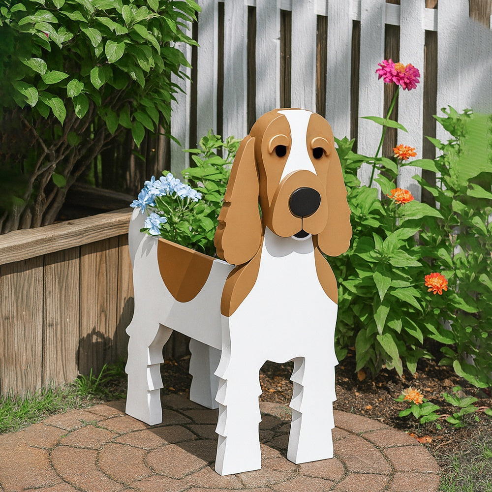 Cocker Spaniel dog planter filled with fresh flowers is placed in the garden