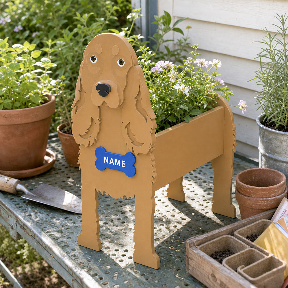 Cocker Spaniel dog planter filled with fresh flowers is placed in the garden