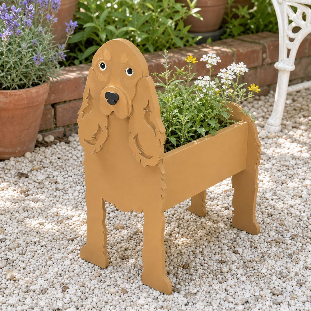 Cocker Spaniel dog planter filled with fresh flowers is placed in the garden