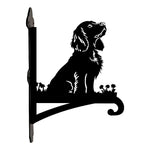 Cocker spaniel metal hanging basket bracket mounted on outdoor wall for plant decoration