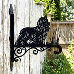 Cocker spaniel metal hanging basket bracket mounted on outdoor wall for plant decoration