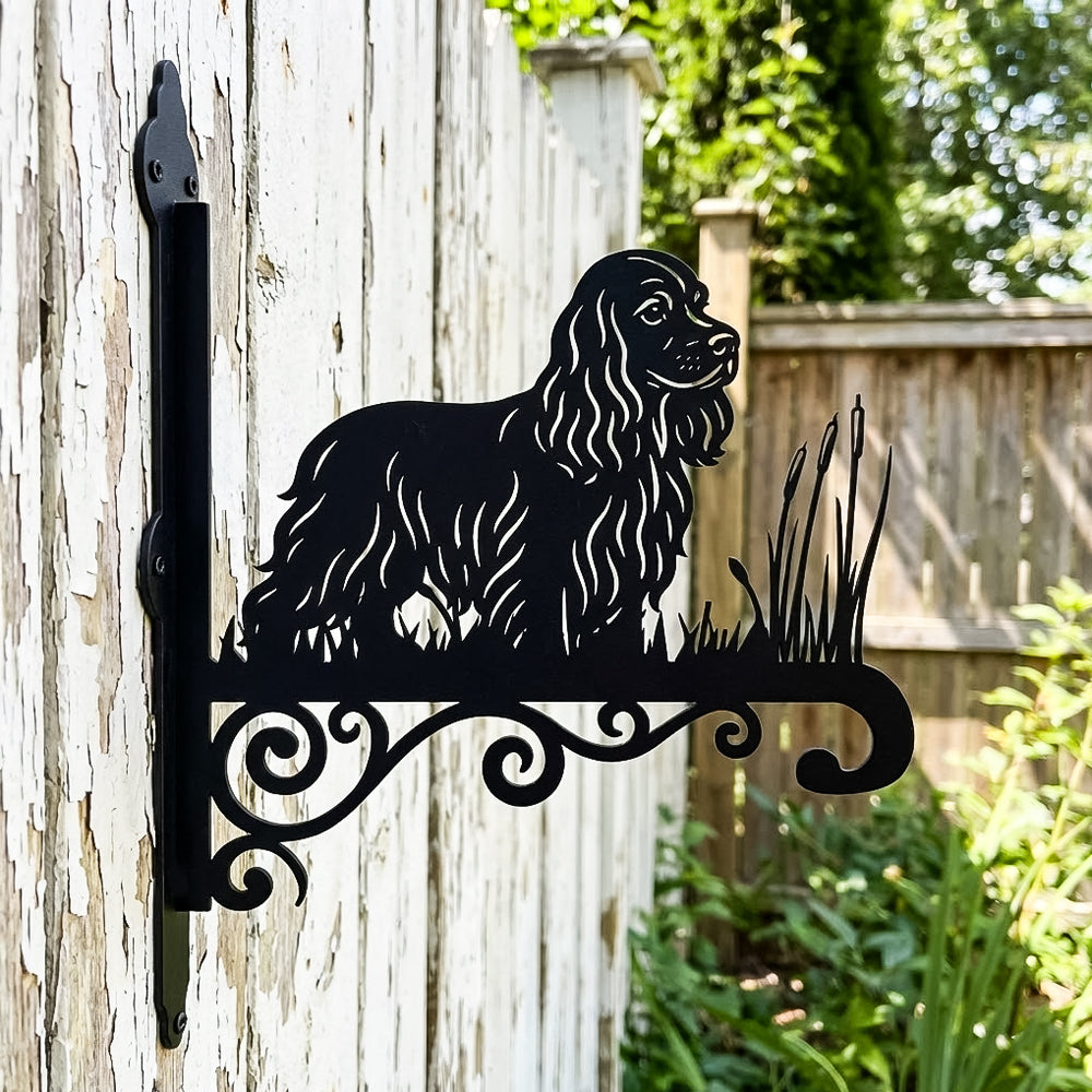 Cocker spaniel metal hanging basket bracket mounted on outdoor wall for plant decoration