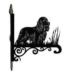 Cocker spaniel metal hanging basket bracket mounted on outdoor wall for plant decoration