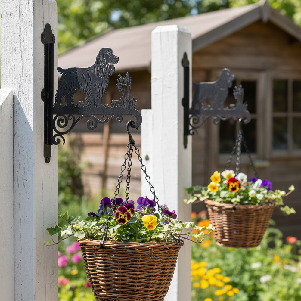 Cocker spaniel metal hanging basket bracket mounted on outdoor wall for plant decoration
