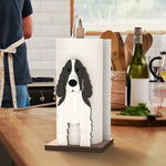 Cocker Spaniel Wooden Dog Paper Towel Holder displayed on a kitchen countertop with a freestanding paper towel roll