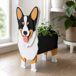 Corgi dog planter filled with fresh flowers is placed in the garden
