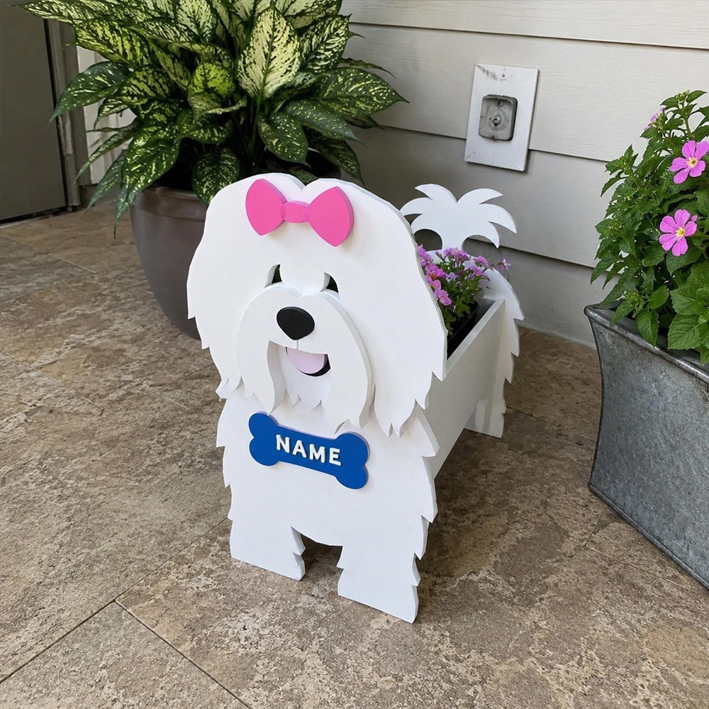 Coton de Tulear dog planter filled with fresh flowers is placed in the garden