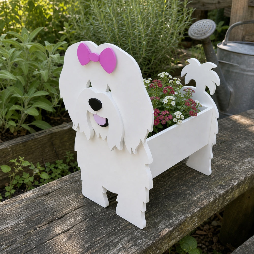 Coton de Tulear dog planter filled with fresh flowers is placed in the garden