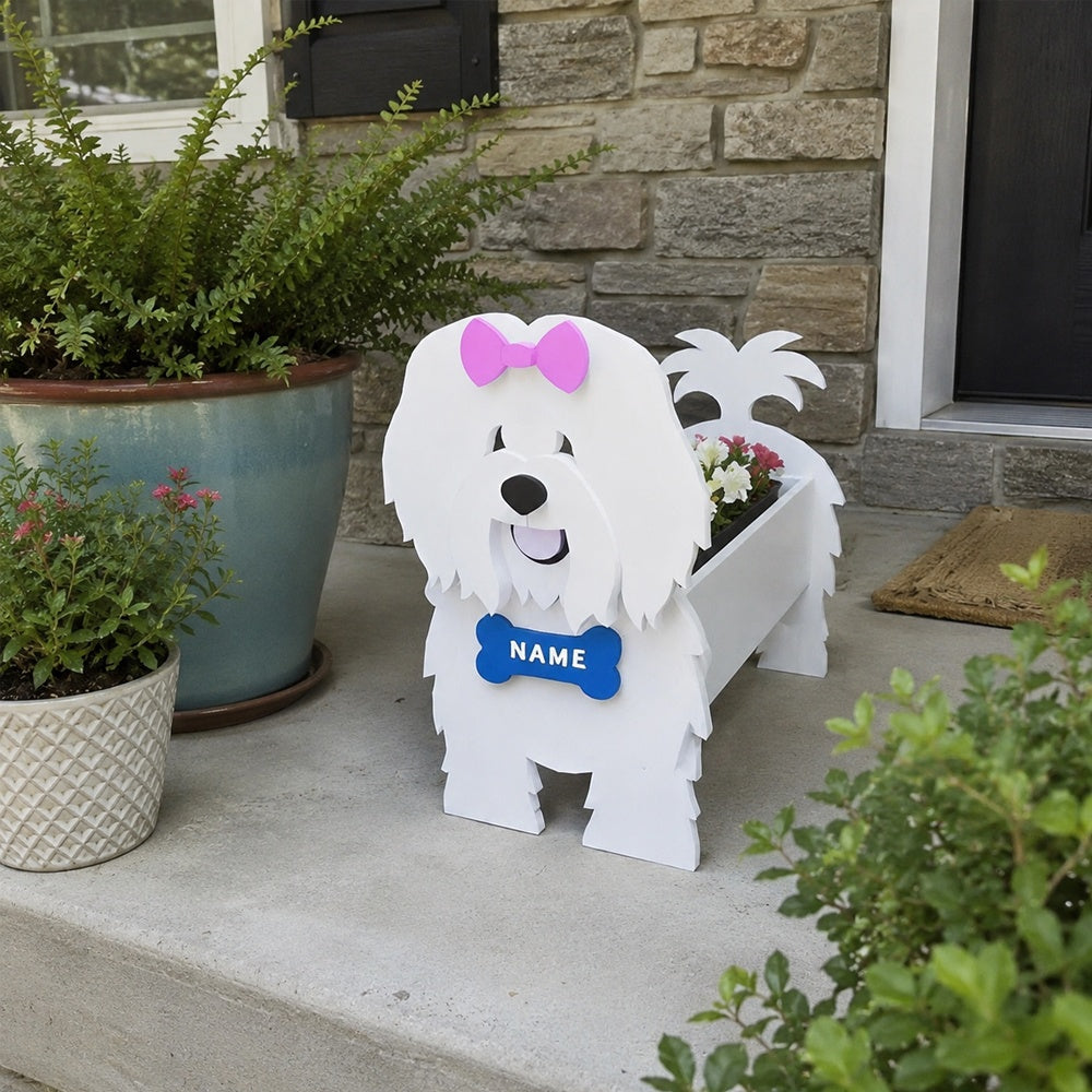 Coton de Tulear dog planter filled with fresh flowers is placed in the garden