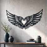 Black metal Cupid Heart wings wall art with intricate cutout details displayed on the wall
