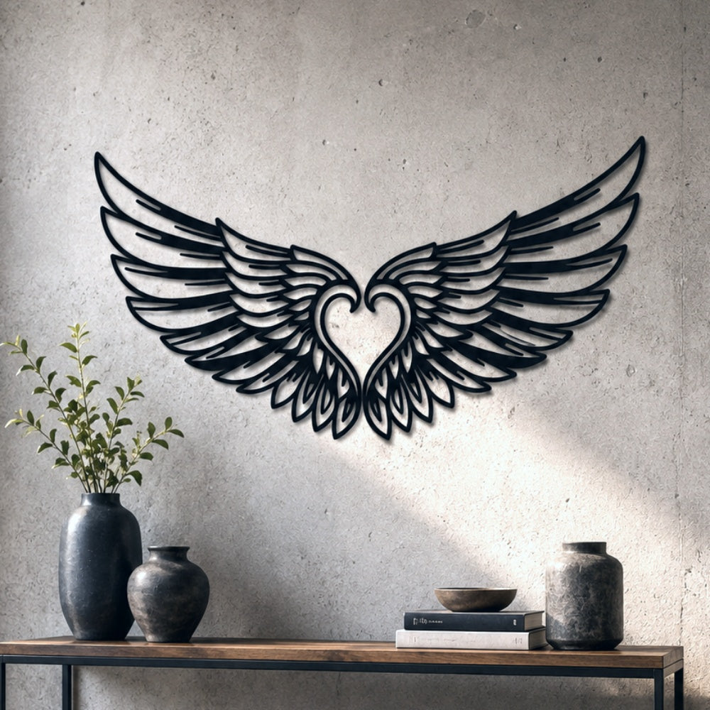 Black metal Cupid Heart wings wall art with intricate cutout details displayed on the wall