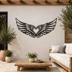 Black metal Cupid Heart wings wall art with intricate cutout details displayed on the wall