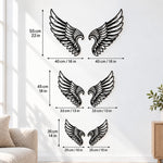 Black metal Cupid Heart wings wall art with intricate cutout details displayed on the wall