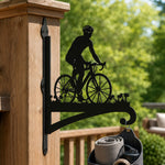Cyclist riding road bike metal hanging basket bracket mounted on outdoor wall for plant decoration