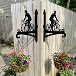 Cyclist riding road bike metal hanging basket bracket mounted on outdoor wall for plant decoration