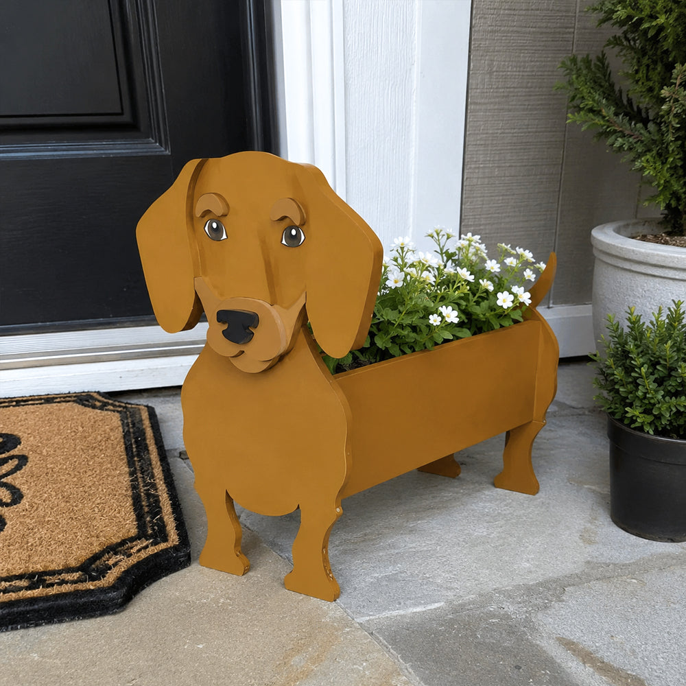 Dachshund dog planter filled with fresh flowers is placed in the garden