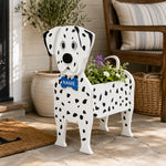 Decorative plant stand shaped like a Dalmatian dog planter on a patio