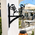 Dancing skeletons metal hanging basket bracket mounted on outdoor wall for plant decoration