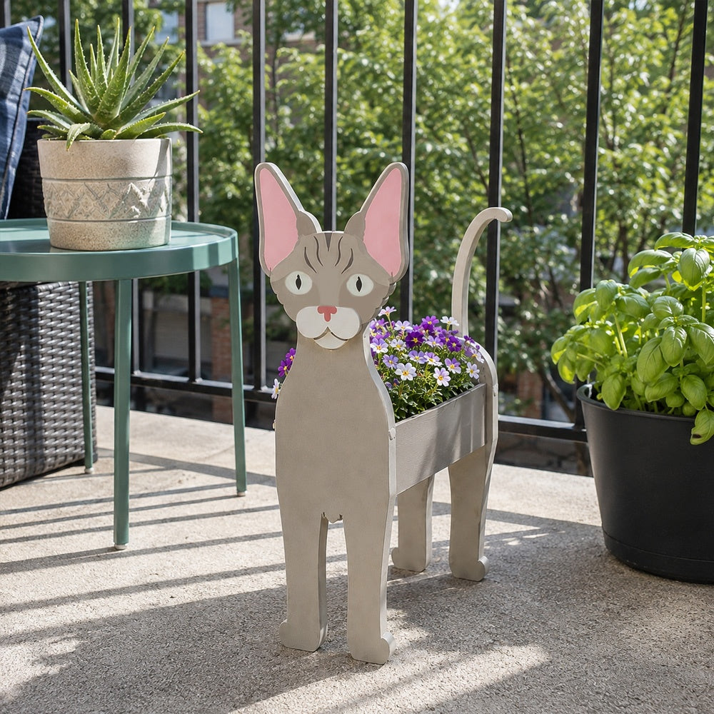 Devon Rex cat planter filled with fresh flowers is placed in the garden