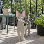 Devon Rex cat planter filled with fresh flowers is placed in the garden