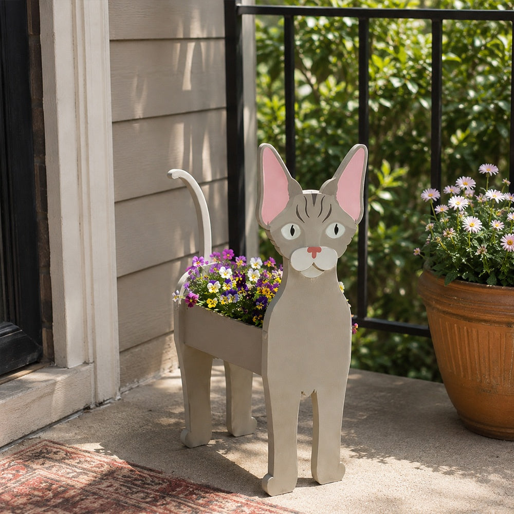 Devon Rex cat planter filled with fresh flowers is placed in the garden