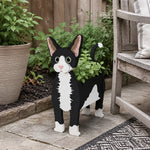 Devon Rex cat planter filled with fresh flowers is placed in the garden