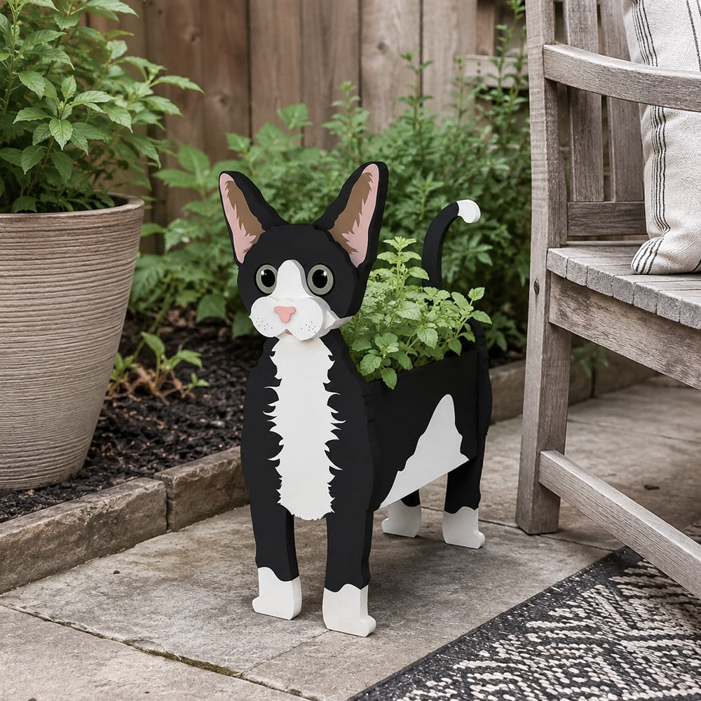 Devon Rex cat planter filled with fresh flowers is placed in the garden