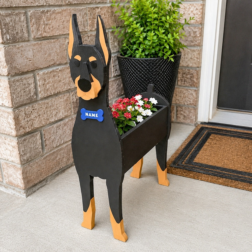 Doberman dog planter filled with fresh flowers is placed in the garden.