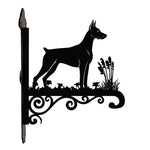 Doberman pinscher metal hanging basket bracket mounted on outdoor wall for plant decoration