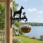 Doberman pinscher metal hanging basket bracket mounted on outdoor wall for plant decoration