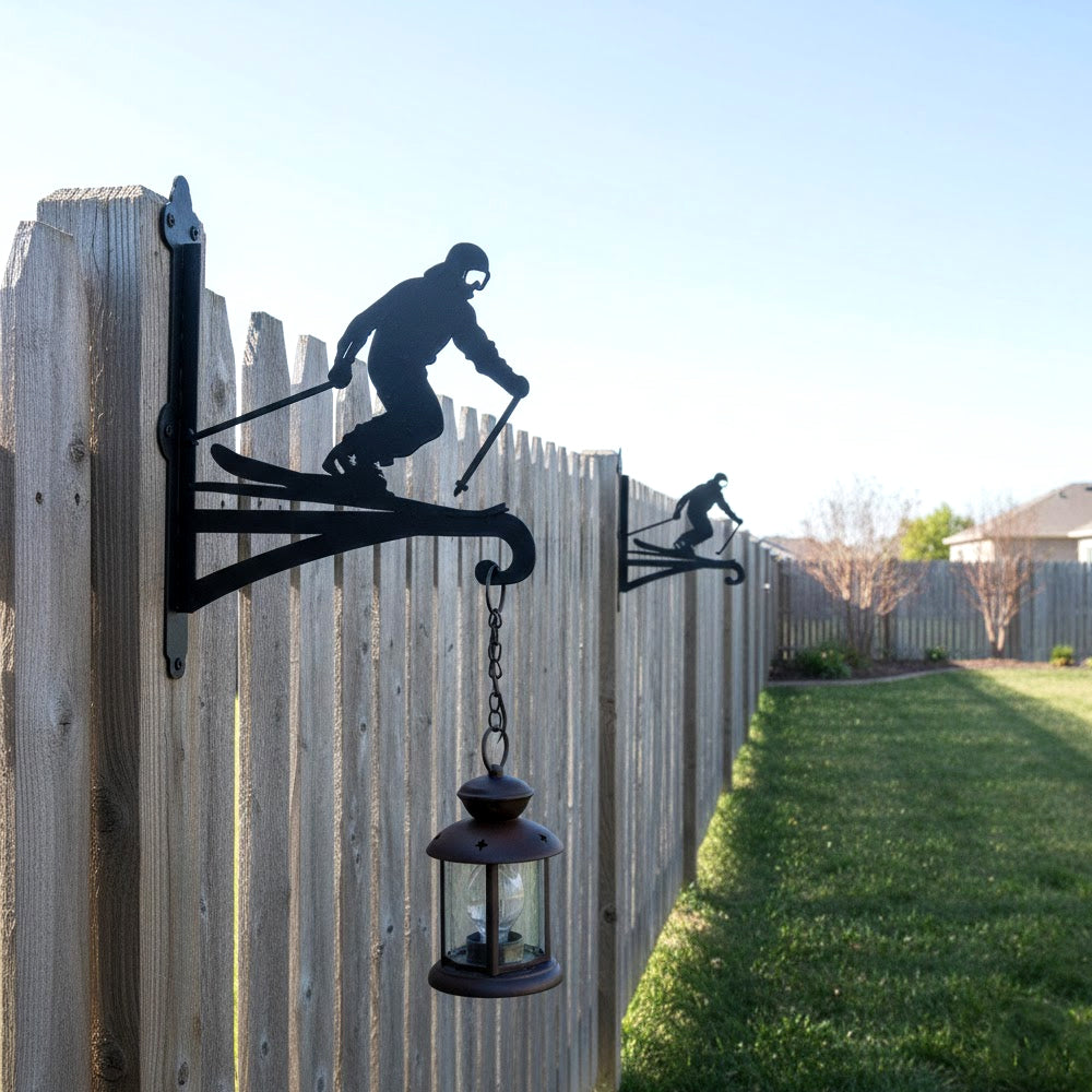 Downhill skier metal hanging basket bracket mounted on outdoor wall for plant decoration