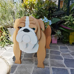 English Bulldog planter filled with fresh flowers is placed in the garden