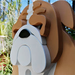 English Bulldog planter filled with fresh flowers is placed in the garden